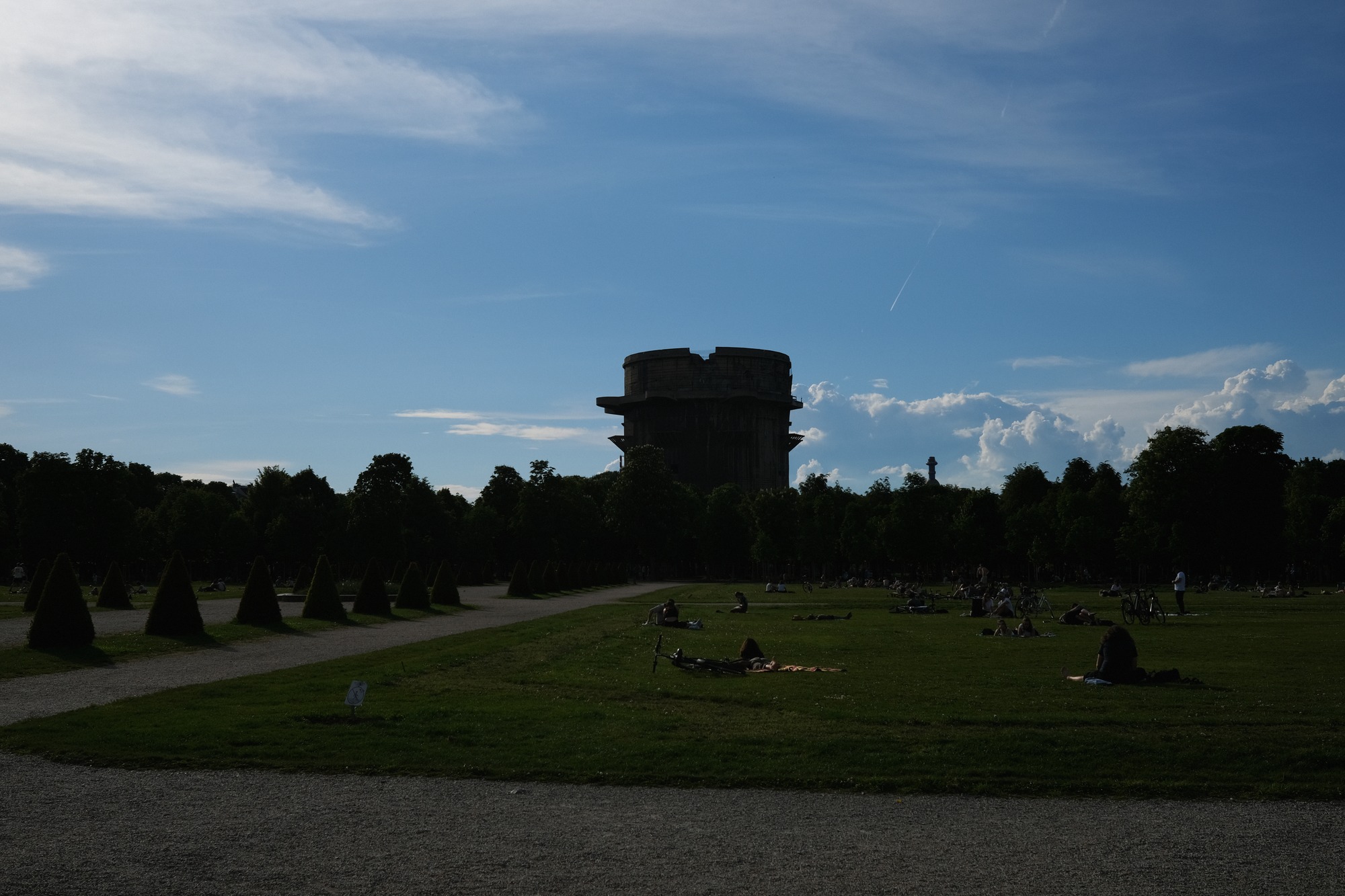 Flak tower silhouette above parkland
