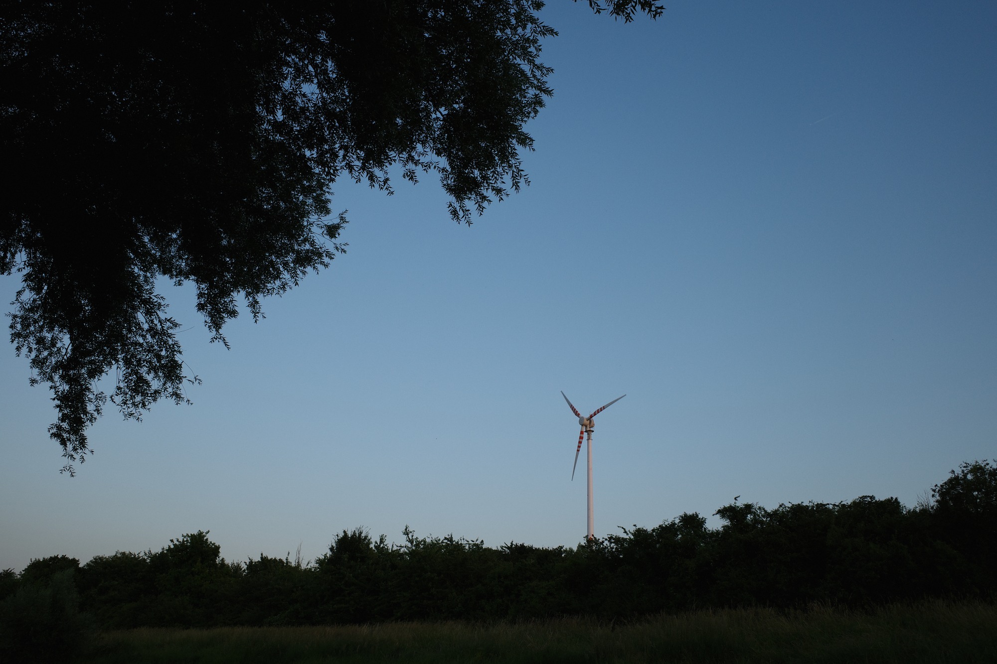 Wind turbine silhouette at blue hour